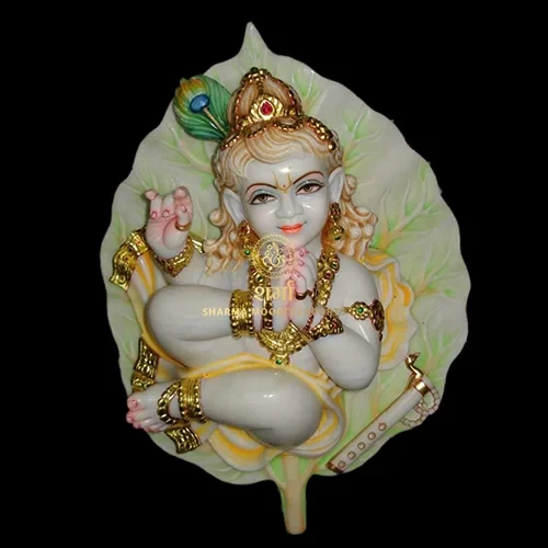 White Marble Krishna Statue Sitting on Leaf